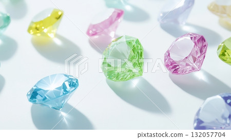 Colorful gemstones reflecting light in various vibrant colors on white surface 132057704