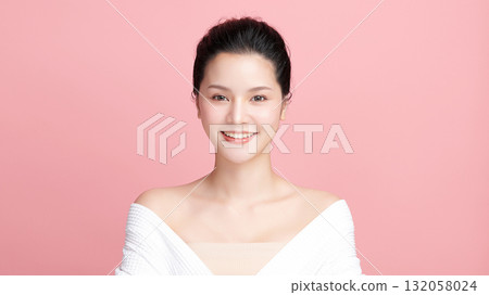 A beautiful young Asian woman with clean, fresh skin against a pink background. Skincare, facial treatment, cosmetology, beauty, and spa. An elegant portrait of an Asian woman. A beautiful young Asian woman with clean, fresh skin against a pink background. Skincare, facial treatment, cosmetology, beauty, and spa. An elegant portrait of an Asian woman. 132058024