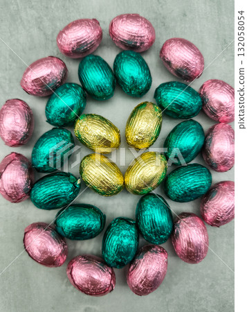 Colorful chocolate eggs celebrating easter as a flower Colorful chocolate eggs celebrating easter as a flower 132058054