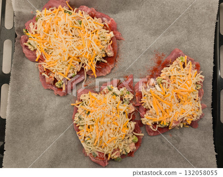 Preparing stuffed Turkey thigh steaks with cheese and vegetables on baking sheet Preparing stuffed Turkey thigh steaks with cheese and vegetables on baking sheet 132058055