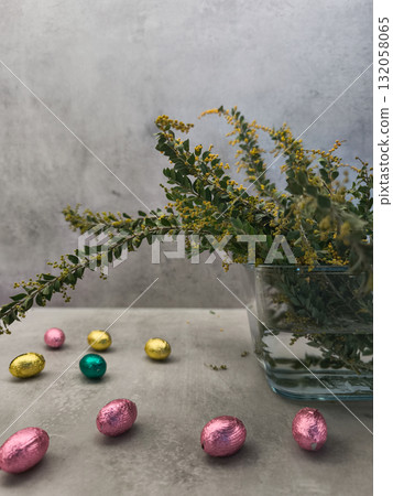 Celebrating orthodox easter with chocolate eggs and mimosa flowers in prague copy space gray background Celebrating orthodox easter with chocolate eggs and mimosa flowers in prague copy space gray background 132058065