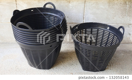 Stack of Black Plastic Strainer Baskets, Plant pot Stack of Black Plastic Strainer Baskets, Plant pot 132058143