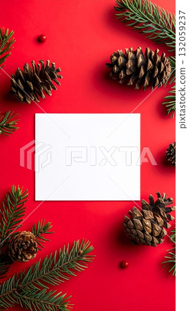 Pine cones and pine needles with blank card on red background 132059237
