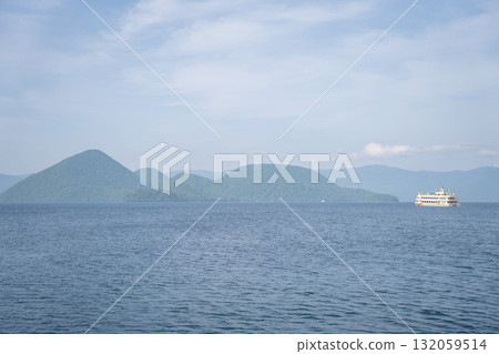 A view of a sightseeing boat and Nakajima Island on Lake Toya A view of a sightseeing boat and Nakajima Island on Lake Toya 132059514