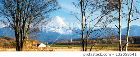 Autumn scenery of the Tokachi mountain range seen from the Misawa area of Biei, Hokkaido Autumn scenery of the Tokachi mountain range seen from the Misawa area of Biei, Hokkaido 132059541