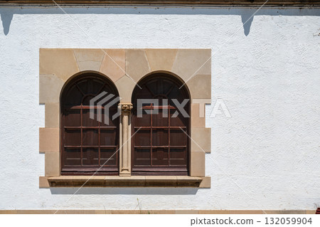 Two windows with bars. 132059904