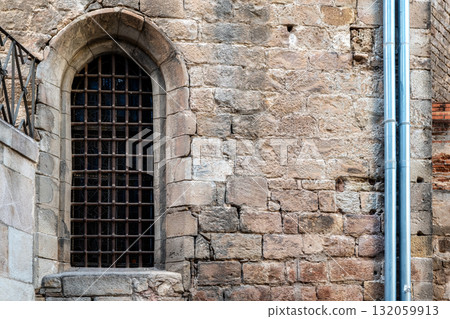 Arched window with bars. Arched window with bars. 132059913