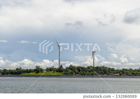 Renewable Wind Energy Turbines on Lush Green Mountain Landscape in Asia Renewable Wind Energy Turbines on Lush Green Mountain Landscape in Asia 132060089