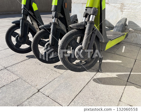 Close-up of electric scooter wheels on pavement Close-up of electric scooter wheels on pavement 132060558