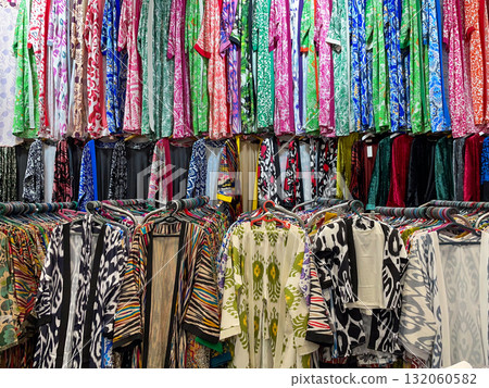 Colorful Patterned Garments on Display Racks Colorful Patterned Garments on Display Racks 132060582
