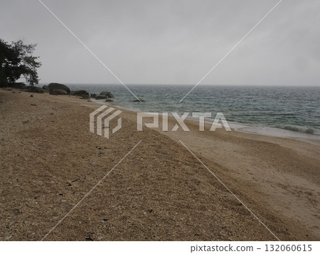 Fitzroy Island – a cloudy beach with shade and rocks Fitzroy Island – a cloudy beach with shade and rocks 132060615