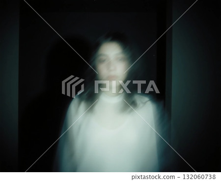 A figure appears blurred and ethereal in a dark space, projecting an unsettling presence. This chilling scene captures the essence of a ghostly encounter at night Generative AI A figure appears blurred and ethereal in a dark space, projecting an unsettling presence. This chilling scene captures the essence of a ghostly encounter at night Generative AI 132060738