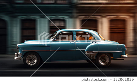 Vintage Blue Car Driving Past Colorful Old Buildings with Motion Blur and Chrome Detailing 132061039
