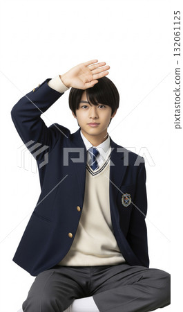 A high school boy making a greeting gesture A high school boy making a greeting gesture 132061125