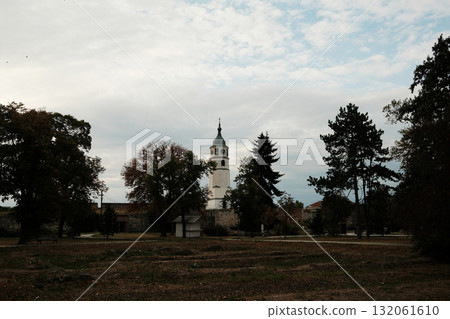 Clock Tower of Kalemegdan Fortress rises above trees on a cloudy autumn morning in Belgrade Clock Tower of Kalemegdan Fortress rises above trees on a cloudy autumn morning in Belgrade 132061610