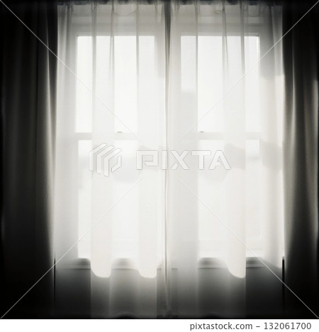 Grey curtains hang loosely in front of a window, allowing soft light to fill the room. The setting conveys tranquility in a simple, inviting space during a quiet afternoon Generative AI 132061700