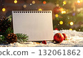 Festive calendar surrounded by Christmas decorations in a cozy winter setting 132061862