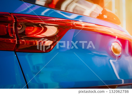 Blue business car with shiny front lights color bright 132062786