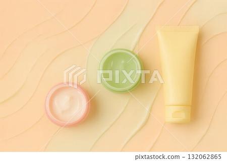 Colorful skincare products arranged on a textured background with soft waves and gradients 132062865