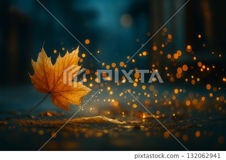 Golden maple leaf surrounded by glowing bokeh lights on a tranquil autumn evening 132062941