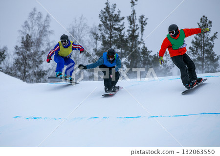 Group snowboarders in competition race snowboard cross Group snowboarders in competition race snowboard cross 132063550