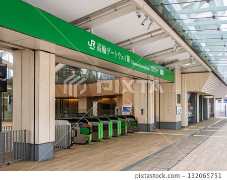 JR East Takanawa Gateway Station name sign and south ticket gate 132065751