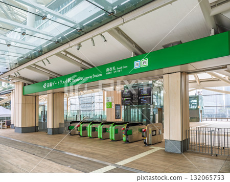 JR East Takanawa Gateway Station name sign and south ticket gate 132065753