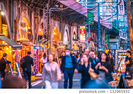 Tokyo cityscape, Japan, October 17th. View of the bar district under the elevated tracks from the Karasumori exit of Shimbashi Station. Tokyo cityscape, Japan, October 17th. View of the bar district under the elevated tracks from the Karasumori exit of Shimbashi Station. 132065932