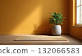 Cozy room with yellow wall, wooden floor, and potted plant by window creates serene atmosphere 132066583