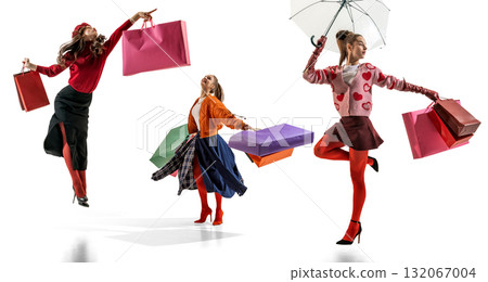 Women jumping with colorful shopping bags expressing fashion happiness Women jumping with colorful shopping bags expressing fashion happiness 132067004