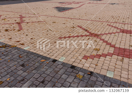 A pattern of red and yellow paving slabs is laid out on Victory Square 132067139