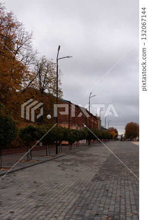 Town square on a cloudy autumn day, red brick buildings Town square on a cloudy autumn day, red brick buildings 132067144