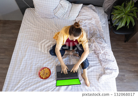 Woman Shops Online on Laptop During Black Friday From the Comfort of Home 132068017