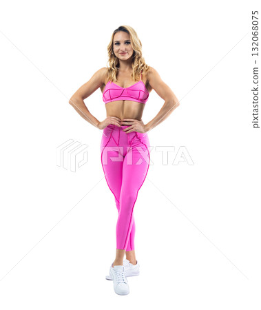 Athletic woman smiling, posing in pink fitness outfiton on transparent background 132068075