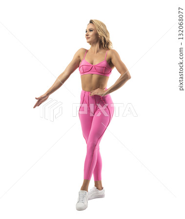 Athletic woman smiling, posing in pink fitness outfiton on transparent background Athletic woman smiling, posing in pink fitness outfiton on transparent background 132068077