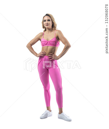Athletic woman smiling, posing in pink fitness outfiton on transparent background Athletic woman smiling, posing in pink fitness outfiton on transparent background 132068078