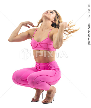 Athletic woman smiling, posing in pink fitness outfiton on transparent background 132068106