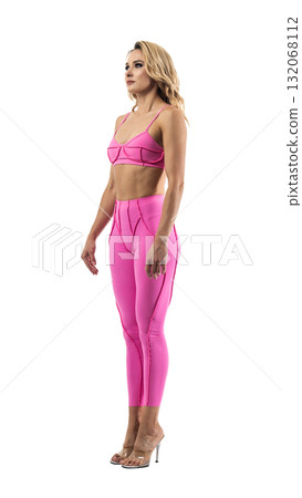 Athletic woman smiling, posing in pink fitness outfiton on transparent background 132068112