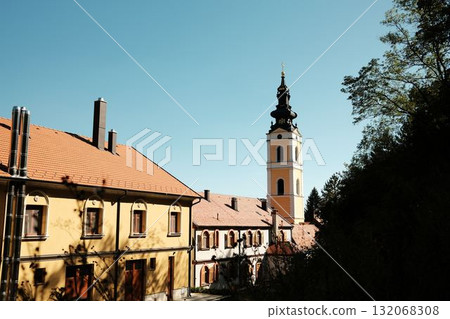 Scenic view of Grgeteg Monastery tower and buildings under clear blue sky in Fruska Gora National Park. Serbia country Scenic view of Grgeteg Monastery tower and buildings under clear blue sky in Fruska Gora National Park. Serbia country 132068308