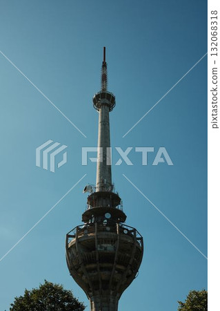Ruined TV tower Iriski Venac on Fruska Gora, destroyed by NATO missile during the Yugoslav war, standing above forest trees Ruined TV tower Iriski Venac on Fruska Gora, destroyed by NATO missile during the Yugoslav war, standing above forest trees 132068318