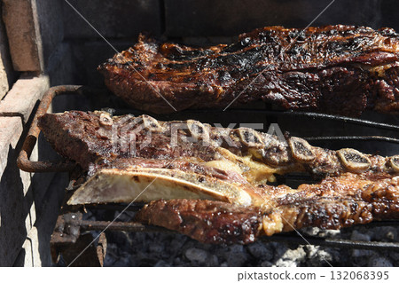 Barbecue, grilled sausages and cow meat , traditional argentine cuisine 132068395