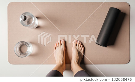 Post Workout Recovery Flat Lay with Bare Feet on Mat 132068476