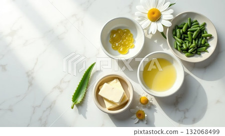 Natural Skincare Ingredients on White Marble Surface 132068499