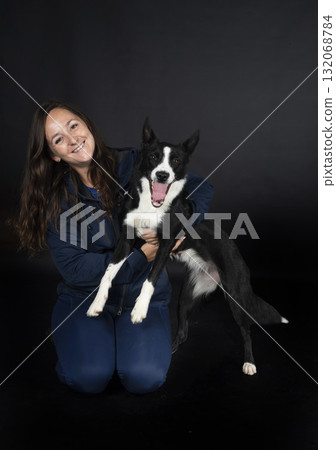 puppy border collie and woman 132068784