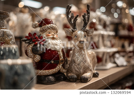 Christmas Santa with reindeer decoration sits on shelf. 132069594