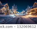 Snowy Christmas street glows with bright lights on houses and trees. 132069612
