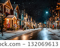 Snowy street with Christmas lights on houses and trees at night. 132069613