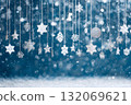 Christmas ornaments hang sparkling in a winter scene with falling snow. 132069621