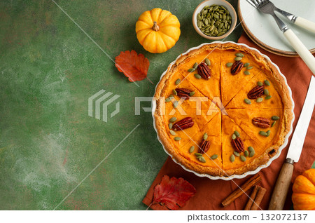 Pumpkin pie, Thanksgiving homemade crust tart, topped with pecan nuts and seeds 132072137