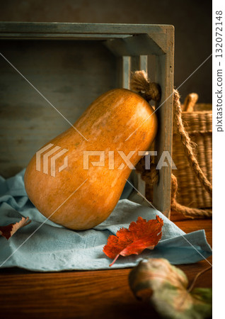 Orange squash, rustic wooden moody background, autumn concept Orange squash, rustic wooden moody background, autumn concept 132072148